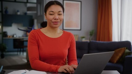 Stress resistance African American mother female mom girl freelancer woman work laptop online at home distant working smiling looking at camera little son boy kid child playing airplane happy family