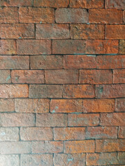 Old orange brick wall, rough surface