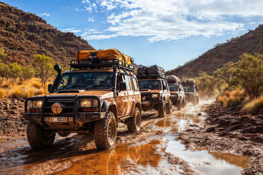 Group of explorers driving on muddy road in the australian outback