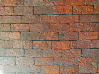 Old orange brick wall, rough surface