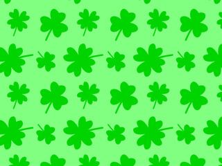 Green three leaves clover and four leaves clover seamless pattern isolated on green background. Lucky. Saint Patrick Day.
