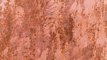 Rusty red metal surface. Painted red surface with lots of rust