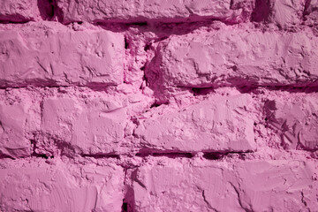 A vibrant pink brick wall texture background that is visually striking and bold in color