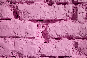 A vibrant pink brick wall texture background that is visually striking and bold in color