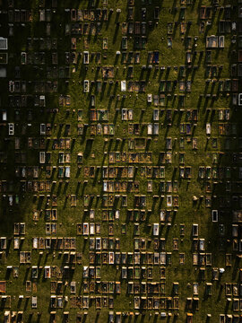 Drone aerial view of a graveyard cemetery in autumn with shadows