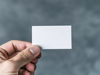 Close-up View of a Business Card Being Handed to a Client During a Consulting Session