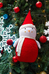 Christmas tree with snowman and snowflake at vertical composition