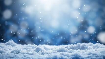 Naklejka premium Christmas ornaments in blue and gold with pine branches and snow, creating a festive and elegant holiday atmosphere.