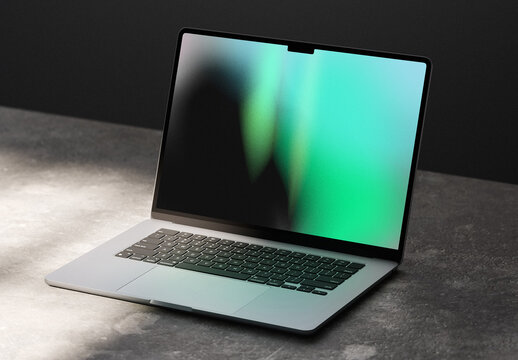 Laptop On The Concrete Table Mockup