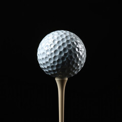 A golf ball teed up isolated on black background