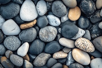 Smooth Pebbles Scattered on Coastal Surface
