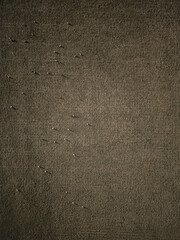 A half empty farming field with sheep only on one side, drone background