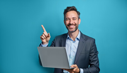 A cheerful businessman holding a laptop and pointing upwards, symbolizing success and innovation. Ideal for corporate presentations, motivational content, or online courses