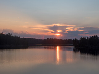 forest lake at sunset with clouds