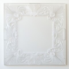 Ornate white decorative frame with intricate floral patterns indoors