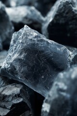 Obraz premium Close-up of jagged dark rock surfaces, revealing natural crystalline patterns.