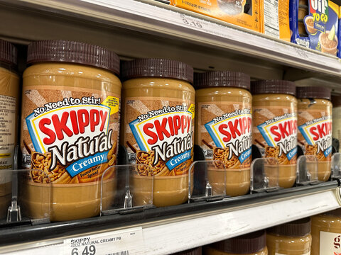 View of several jars of Skippy peanut butter on display at a local Target grocery store.