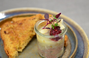 Czech traditional food, pate, spread with liver and minced meat, food served on a plate in a restaurant with toast