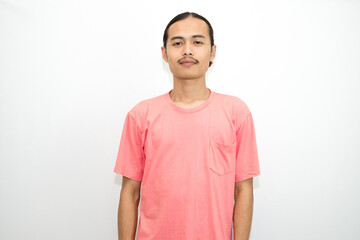 Obraz premium An Indonesian, Asian man wearing a pink tshirt formal style involving his partner with standing confidence like a mature person and a young businessman. isolated in white background