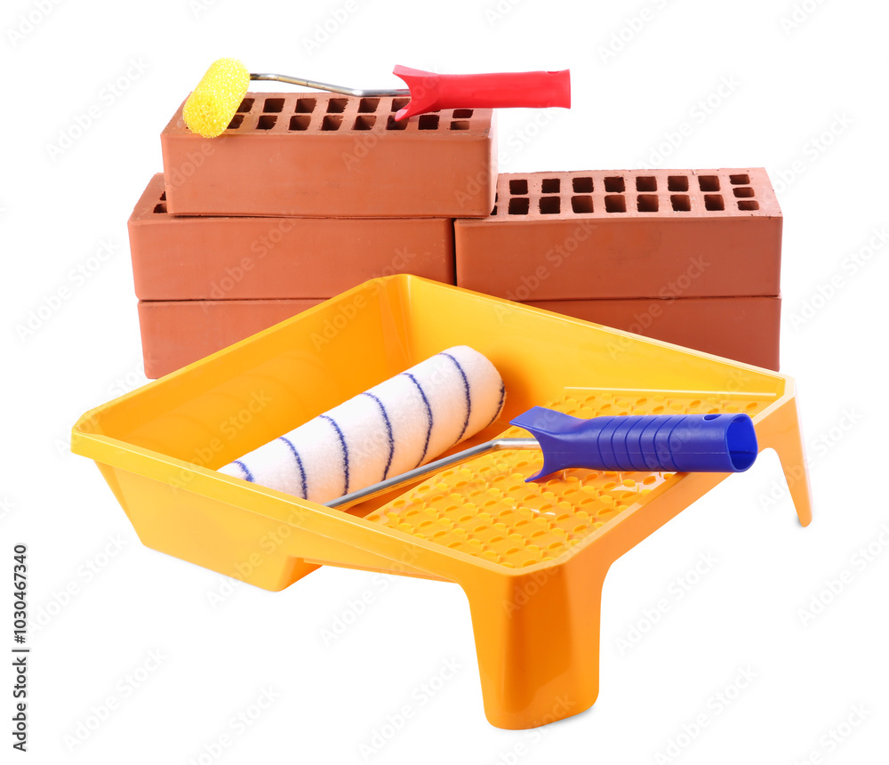 Sticker Red bricks, rollers and tray isolated on white. Building material and construction tools