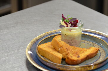 Czech traditional food, pate, spread with liver and minced meat, food served on a plate in a restaurant with toast