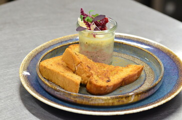 Czech traditional food, pate, spread with liver and minced meat, food served on a plate in a restaurant with toast