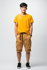 Naklejka premium A man in yellow color casual outfit standing in the studio with isolated background