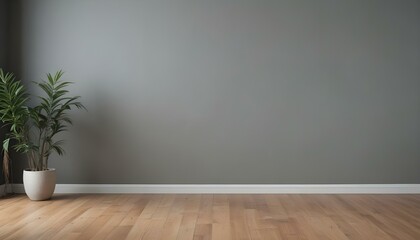 An empty room with a gray wall and a wooden floor.