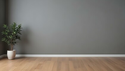 An empty room with a gray wall and a wooden floor.