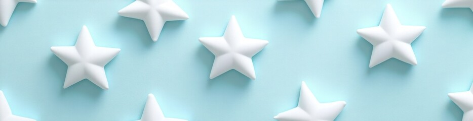 Obraz premium A pattern of white stars on a soft blue background, creating a whimsical design.