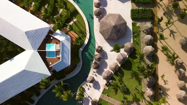 Top aerial view of a luxury resort on the coast of the Dominican Republic. A popular exclusive resort. A beach with golden sand. Paradise tropical nature, exotic holidays, vacations, travel.