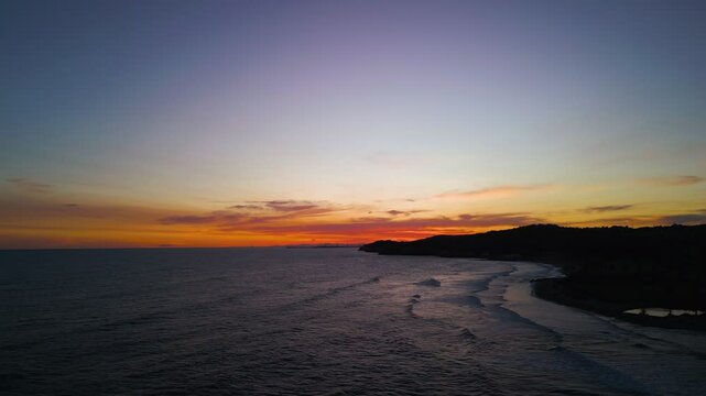 Aerial view of the Mediterranean Sea during sunset hours by the coastal Town of Terramar