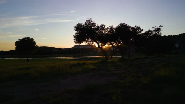 Aerial view of a golf course during sunset