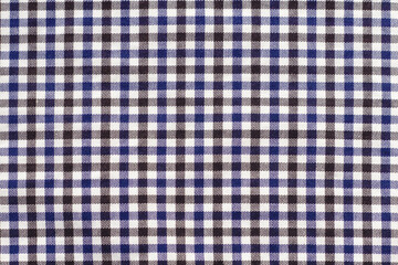 Black, white and blue plaid fabric background