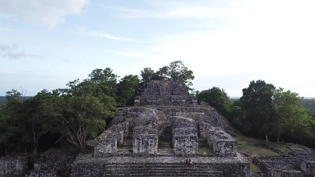 Aerial view, drone flying over the Calakmul pyramid in the Campeche jungle, Mexico