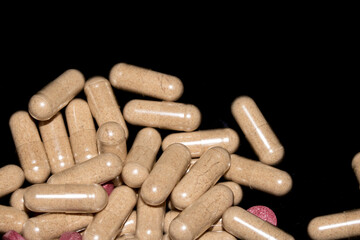 Vitamin Capsules and Pills on a White Background For Medication round and long shaped