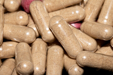 Vitamin Capsules and Pills on a White Background For Medication round and long shaped