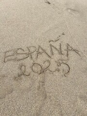 inscription on the sand &bdquo;Espa&ntilde;a 2025&rdquo;