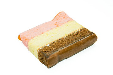 Piece of layer cake isolated on white background