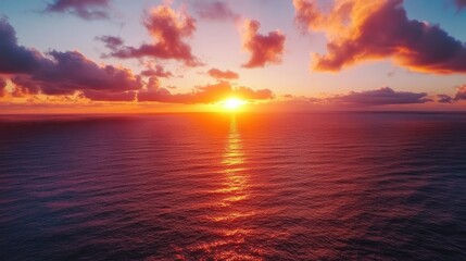 Obraz premium Aerial view of Epic Sunset over the Ocean and Sky with Clouds on the Horizon 