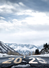 close-up to asphalt road with 2025 road sign painting on the road surface; winter nature scene; concept of making 2025 plans, creating clear roadmap for business or personal purpose; copy space