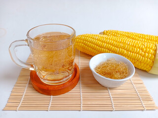 Corn hair or corn silk boiled water in a glass, has the benefit of lowering blood pressure, high cholesterol and arthritis