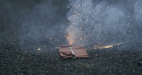 Slow-motion close-up of fireworks igniting at 800 fps, showcasing dramatic sparks and smoke effects, capturing the excitement and intensity of the moment