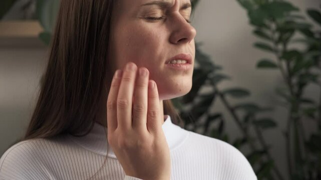 Teeth pain and dentistry caucasian young woman suffering touching her cheek. Female feeling painful toothache. Unhappy feel bad, diseases in oral, ache nerve and molar. Jaw pain, health care concept