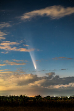 Comet C/2023 A3 Tsuchinshan ATLAS is traveling through space. The comet appears in the early evening after sunset or in the early morning before sunrise