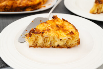 Slice of Phyllo dough pie with cream cheese filling close-up