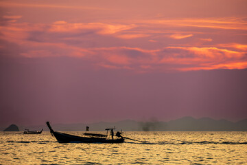 Longtail boat at sunset at Ao Nang Beach, Thailand