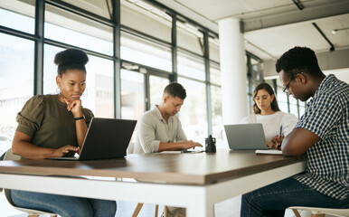 Group, creative and business people in coworking space on laptop, writing notes or editing together. Team, computer and workspace for planning, reading or research for copywriting in startup meeting