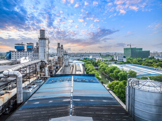 Chemical plant industrial building with equipment at sunset