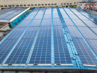Aerial view of solar panels on factory roof